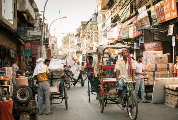 Rickshaw drivers peddling through the streets of Old Delhi. September 18, 2014. iStock.com/Elena Ermakova